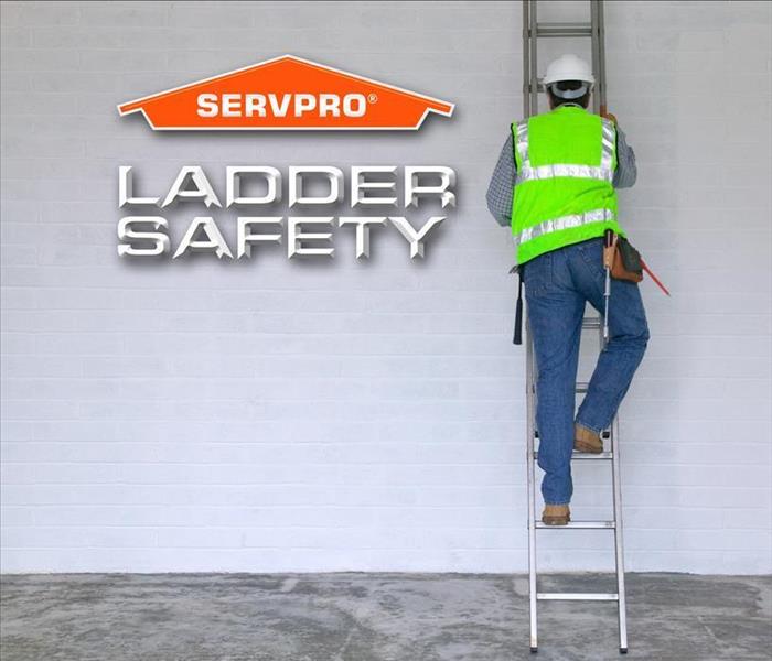 a worker climbing down a ladder and a SERVPRO Logo with the words Ladder Safety in the picture