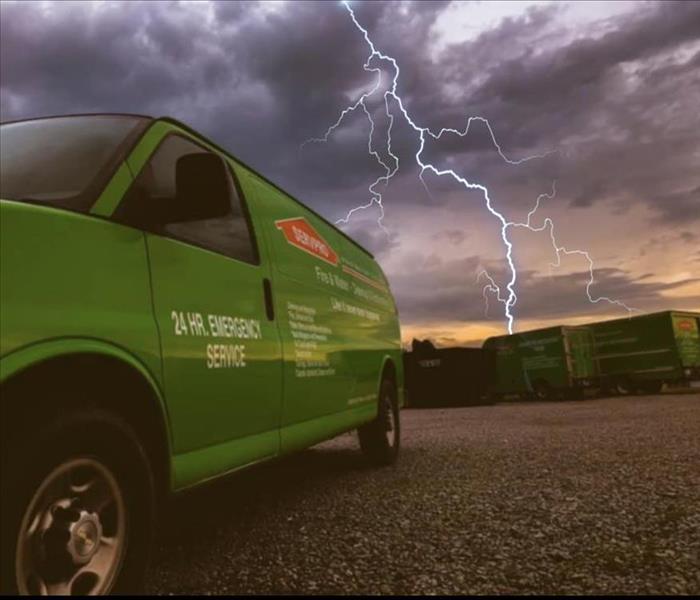 SERVPRO van in with a thunderstorm brewing in the background