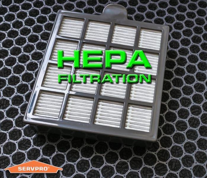 a picture of a hepa filter with the words HEPA FILTER in green letters